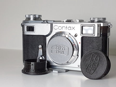 Custom Petrakla Contax body cap, one grey or black.